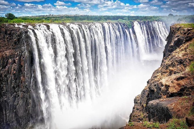 Victoria Falls Guided Tour with Hotel Pickup - The bridge between Zimbabwe and Zambia