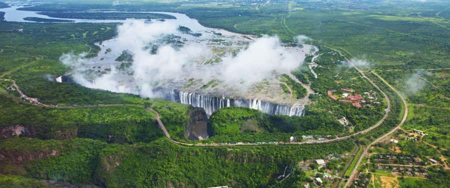Victoria Falls Scenic Day Tour with Lunch & Helicopter Tour - What the falls feel like from the path